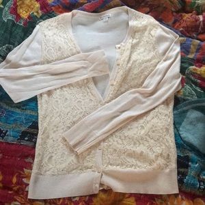 Cream colored lace cardigan.